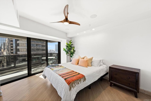 bedroom with access to outside, ceiling fan, and light hardwood / wood-style floors