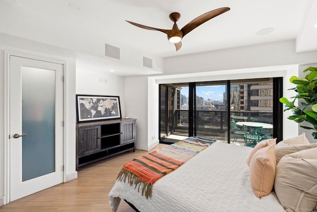 bedroom with ceiling fan, access to exterior, and light wood-type flooring