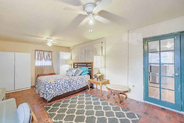 bedroom featuring ceiling fan and multiple windows