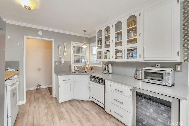 kitchen featuring wine cooler, white cabinets, sink, and white electric stove