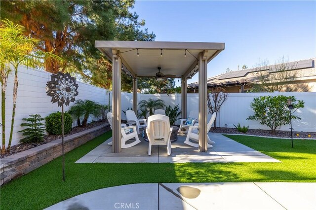 view of patio / terrace featuring ceiling fan