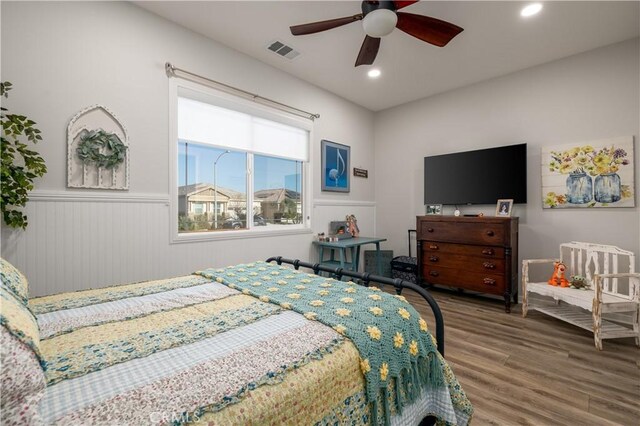 bedroom with ceiling fan and wood-type flooring