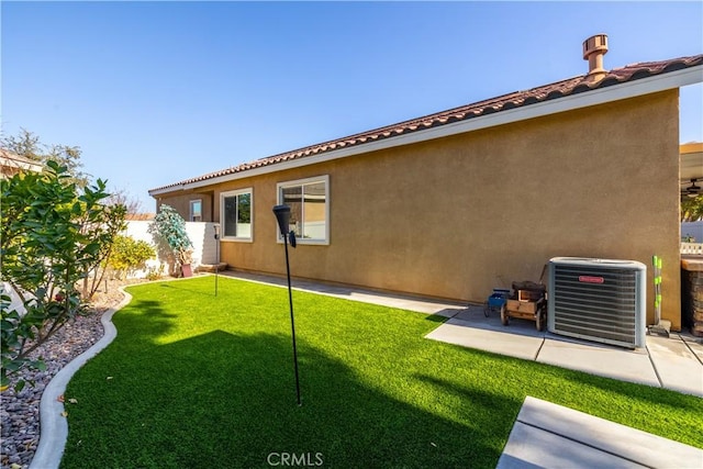 view of yard featuring a patio area and central air condition unit