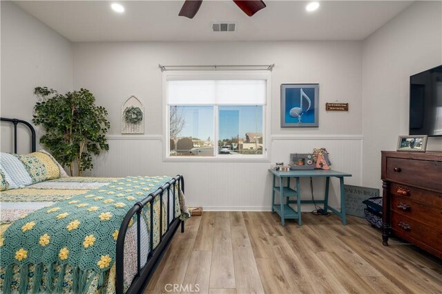 bedroom featuring ceiling fan and light hardwood / wood-style floors