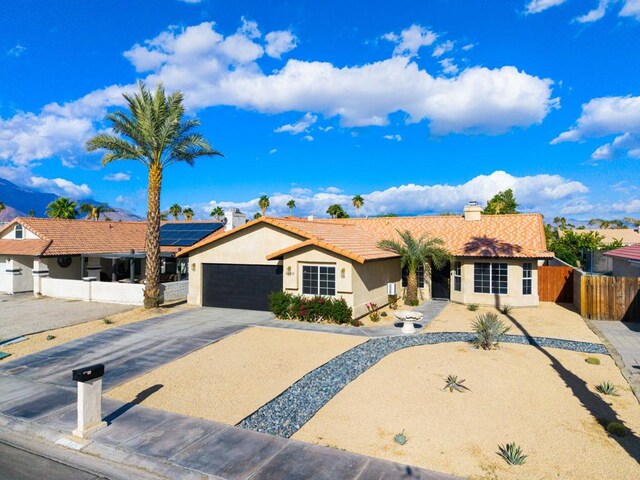 single story home with a garage