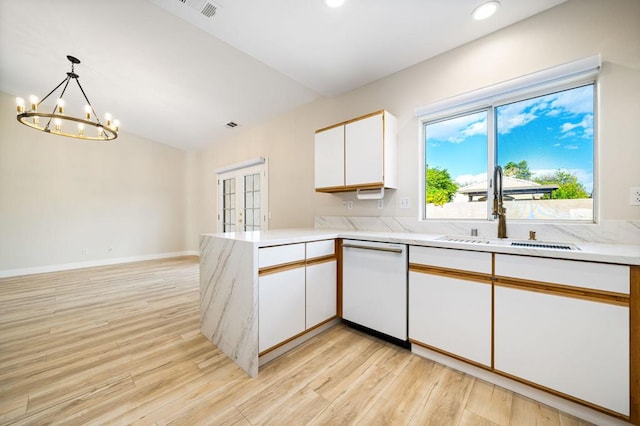 kitchen featuring decorative light fixtures, kitchen peninsula, sink, white dishwasher, and white cabinetry