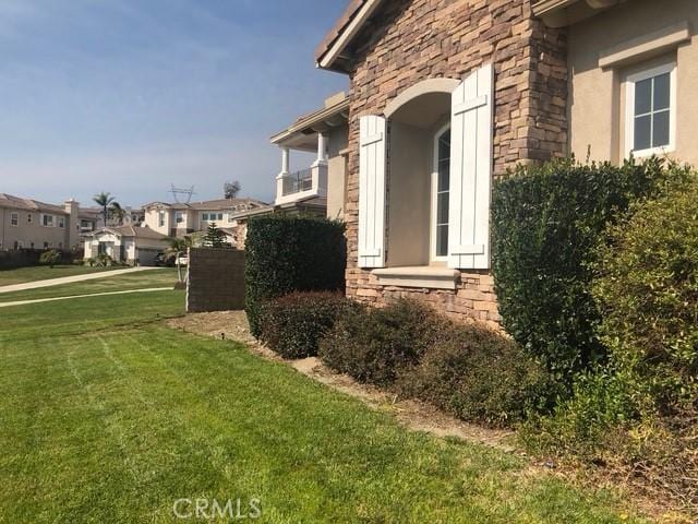 11090 Hiddentrail Dr, Rancho Cucamonga, CA 91737 - view of home's exterior with a yard