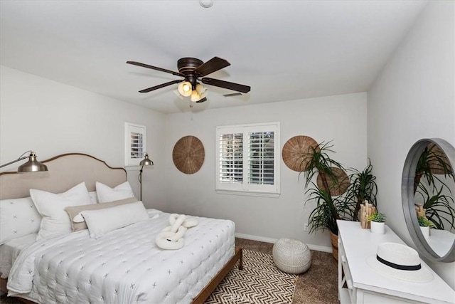 bedroom with ceiling fan and carpet