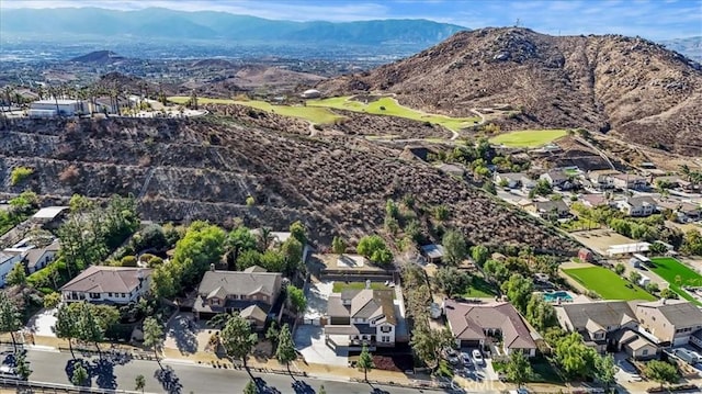 birds eye view of property featuring a mountain view