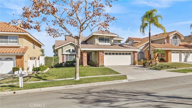 view of front of house with a garage and a front yard