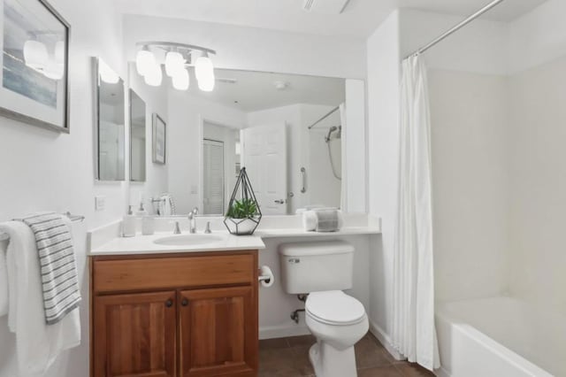 full bathroom featuring shower / bath combo with shower curtain, tile patterned floors, toilet, and vanity