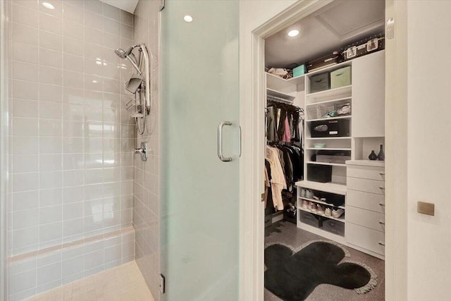 bathroom featuring a shower with door