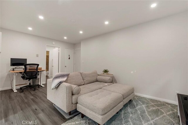 living room featuring dark wood-type flooring