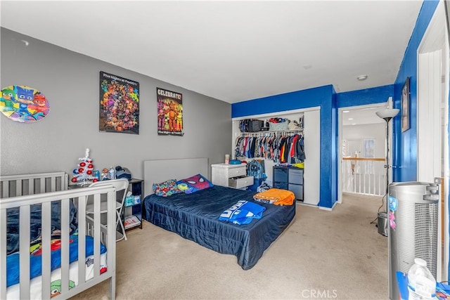 carpeted bedroom featuring a closet