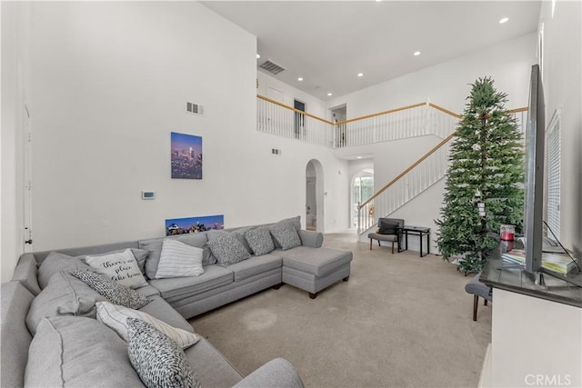 living room with a high ceiling