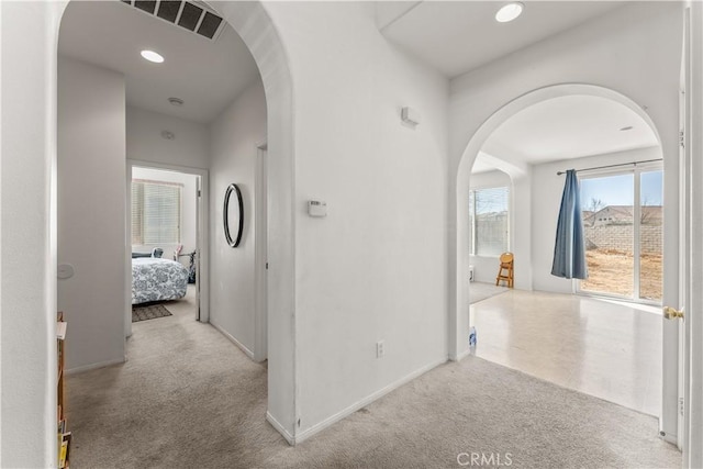 hallway with light carpet