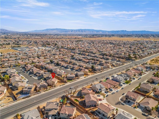 birds eye view of property with a mountain view