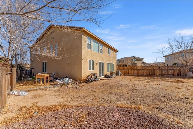 rear view of property featuring cooling unit