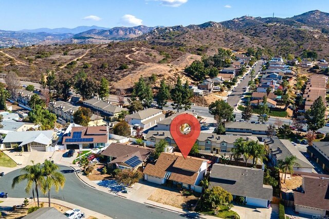 drone / aerial view featuring a mountain view