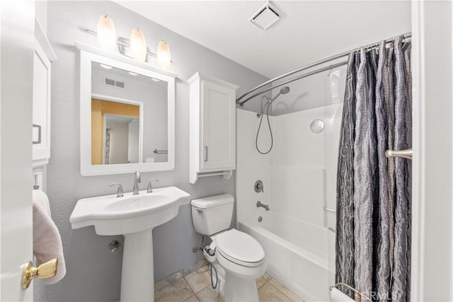 bathroom with toilet, shower / tub combo with curtain, and tile patterned floors