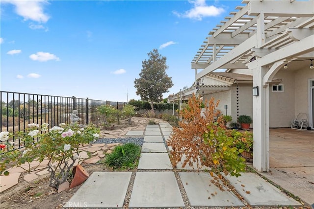 view of yard with a pergola and a patio