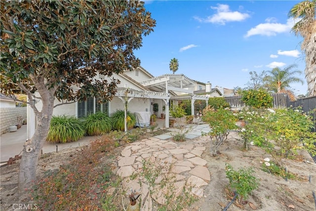 exterior space featuring a patio and a pergola