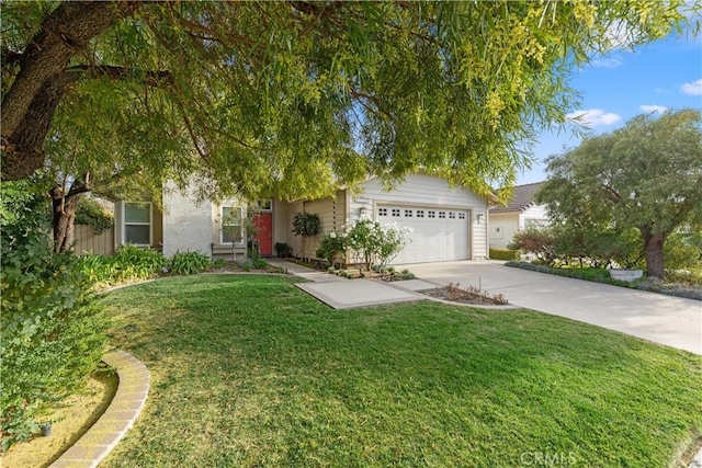 obstructed view of property featuring a front lawn and a garage