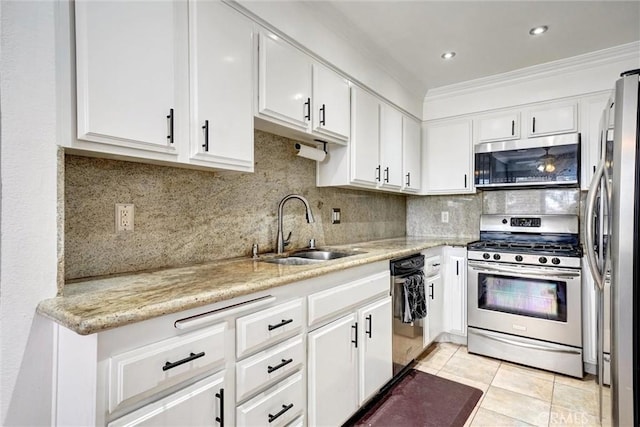 kitchen featuring stainless steel appliances, ornamental molding, white cabinets, and sink