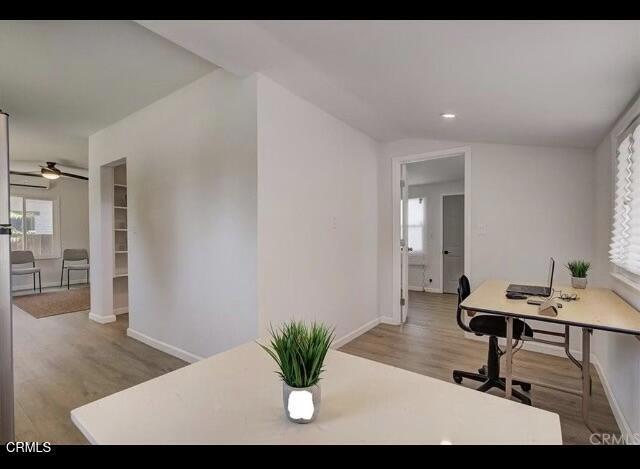 office area featuring ceiling fan and light wood-type flooring