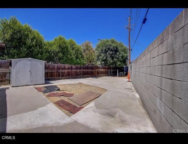 view of patio / terrace featuring a storage shed