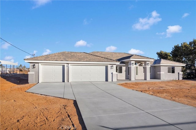 ranch-style home featuring a garage