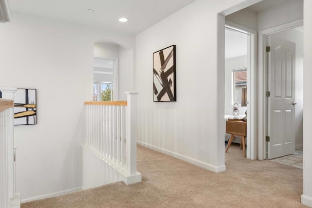 hallway with light carpet