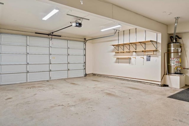 garage featuring a garage door opener and strapped water heater