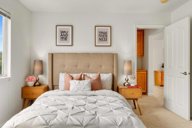 bedroom featuring light carpet