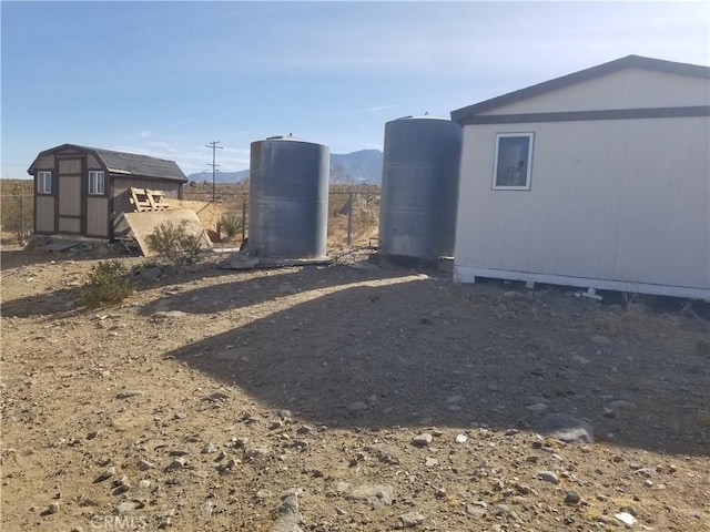 31072 Azurite Rd, Lucerne Valley, CA 92356 - view of yard featuring an outbuilding and a storage unit