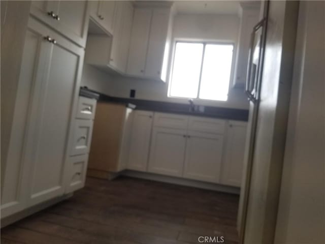 31072 Azurite Rd, Lucerne Valley, CA 92356 - kitchen featuring dark countertops, freestanding refrigerator, a sink, and dark wood-style flooring