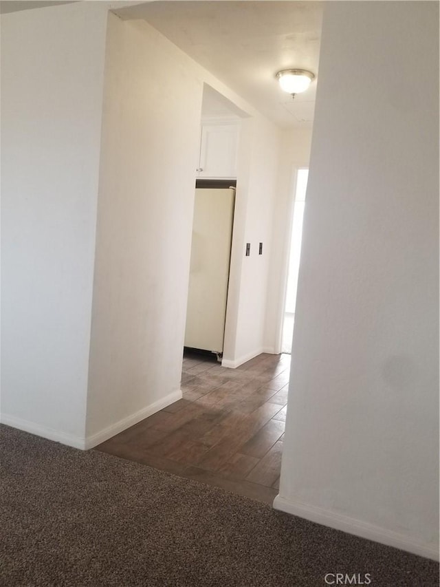 31072 Azurite Rd, Lucerne Valley, CA 92356 - hallway with baseboards, wood finished floors, and carpet