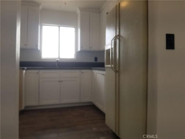 31072 Azurite Rd, Lucerne Valley, CA 92356 - kitchen with a sink, white cabinetry, white fridge with ice dispenser, dark countertops, and dark wood-style flooring