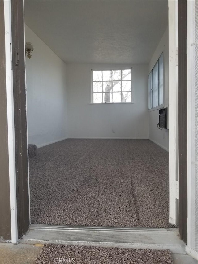 31072 Azurite Rd, Lucerne Valley, CA 92356 - empty room featuring a wall mounted AC and carpet