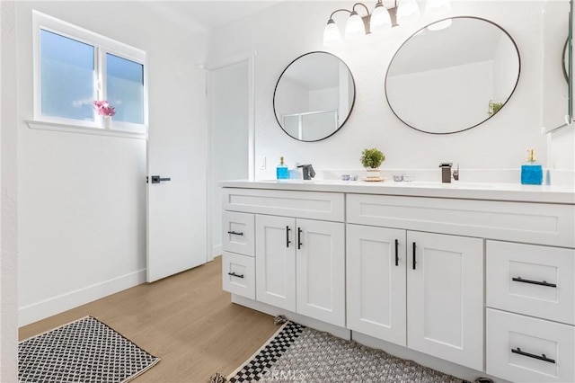 bathroom featuring vanity and hardwood / wood-style floors