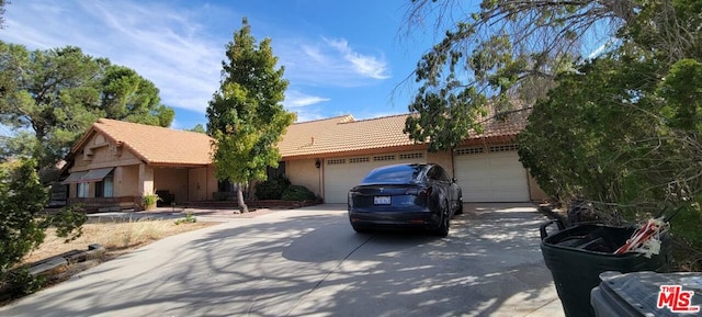 single story home featuring a garage