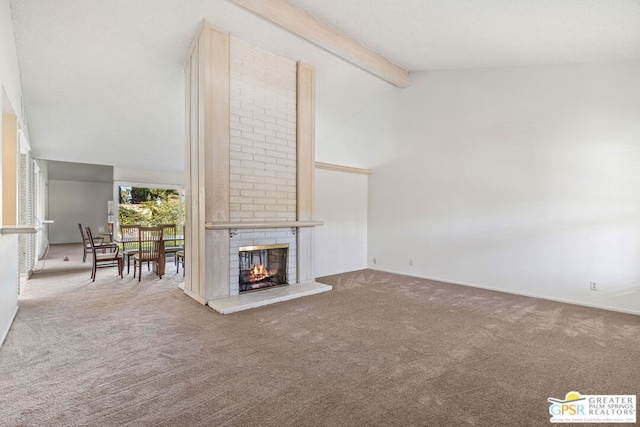 unfurnished living room with carpet floors, vaulted ceiling with beams, and a fireplace