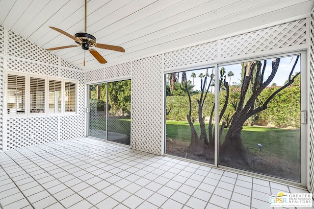 unfurnished sunroom with lofted ceiling and ceiling fan