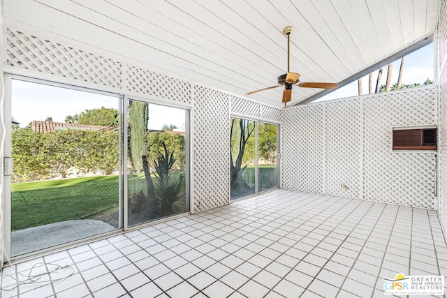 unfurnished sunroom with ceiling fan, wooden ceiling, and lofted ceiling