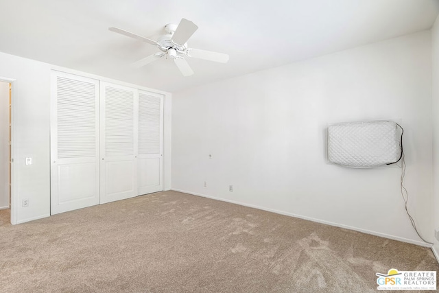 unfurnished bedroom featuring ceiling fan, a closet, and carpet floors