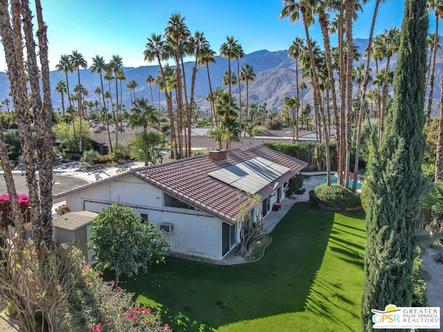 birds eye view of property featuring a mountain view