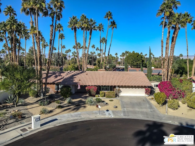 ranch-style house featuring a garage