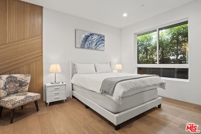 bedroom with light hardwood / wood-style floors