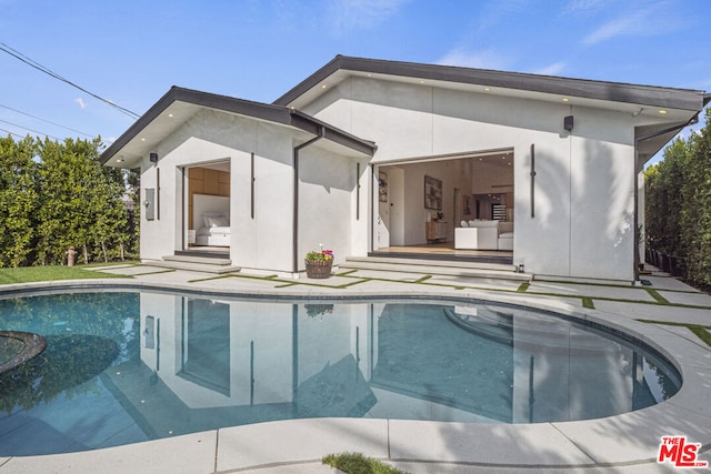 rear view of house with a patio