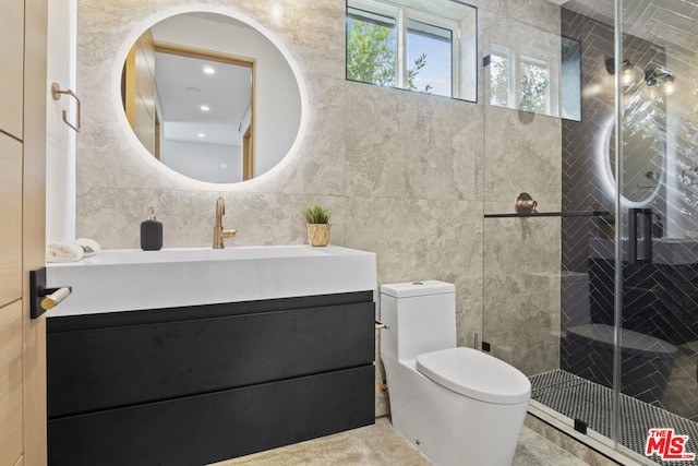 bathroom featuring a shower with shower door, tile walls, toilet, and vanity